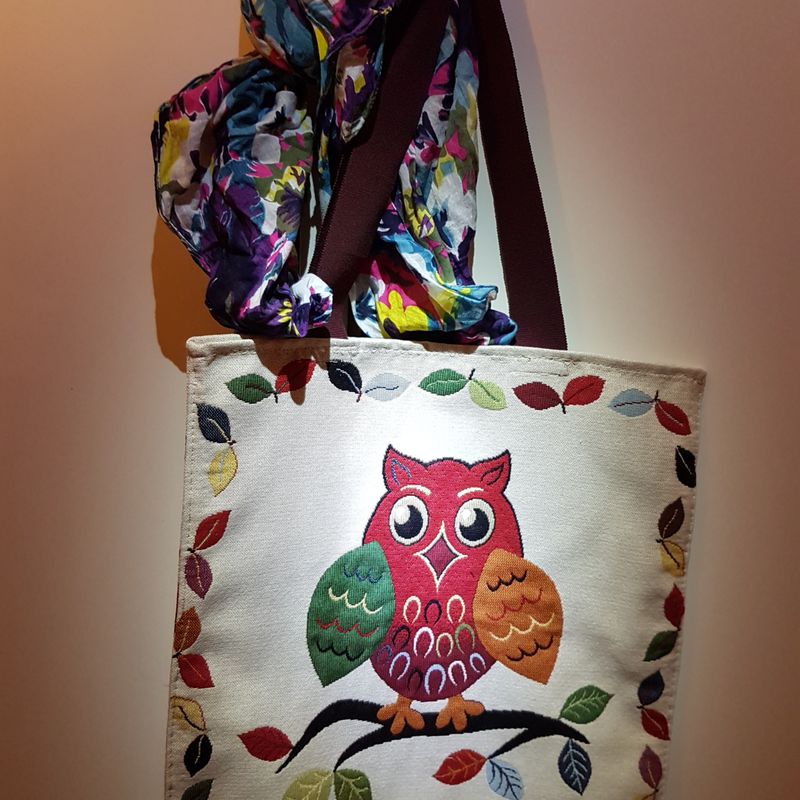 Handmade fabric bag with a colorful owl