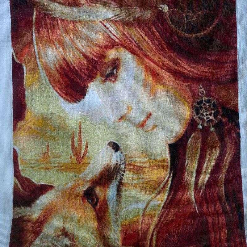 Completed girl and fox cross-stitch embroidery