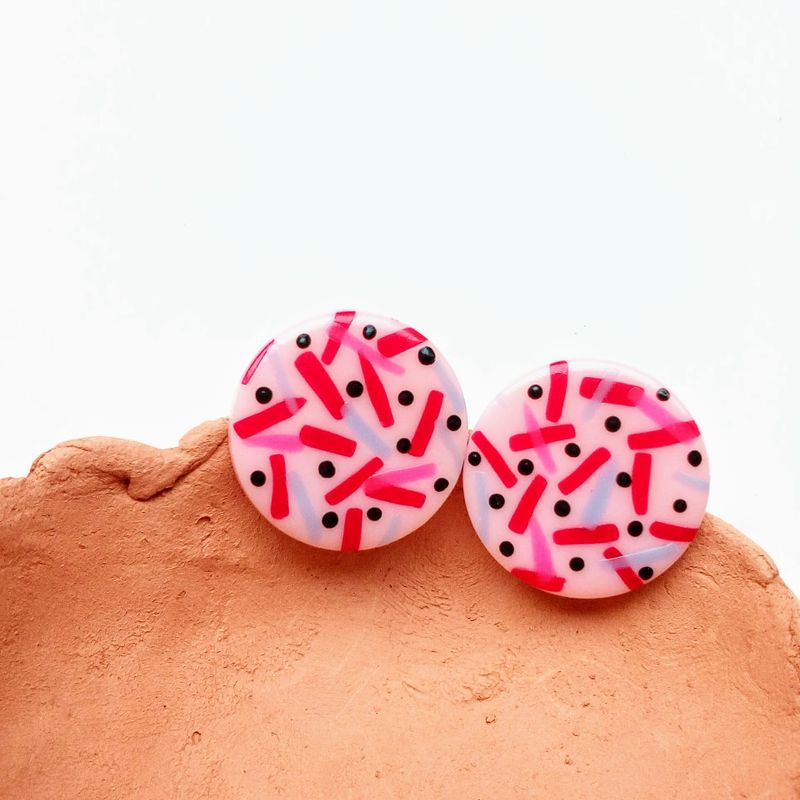 Big round 80s style polymer clay studs in carmine red, neon pink and pink tones