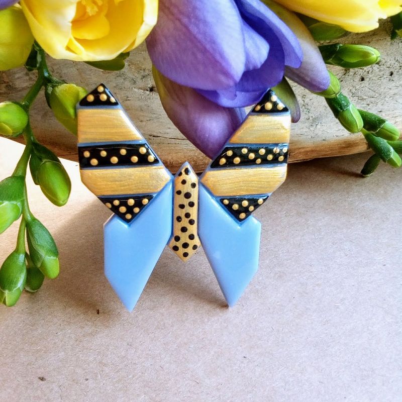 Minimalist graphic origami style butterfly brooches made of polymer clay