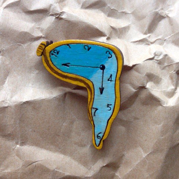 "Soft clocks" brooch