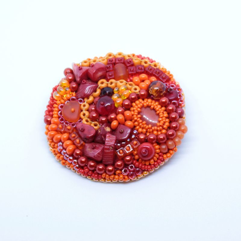 Orange red beadwork brooch