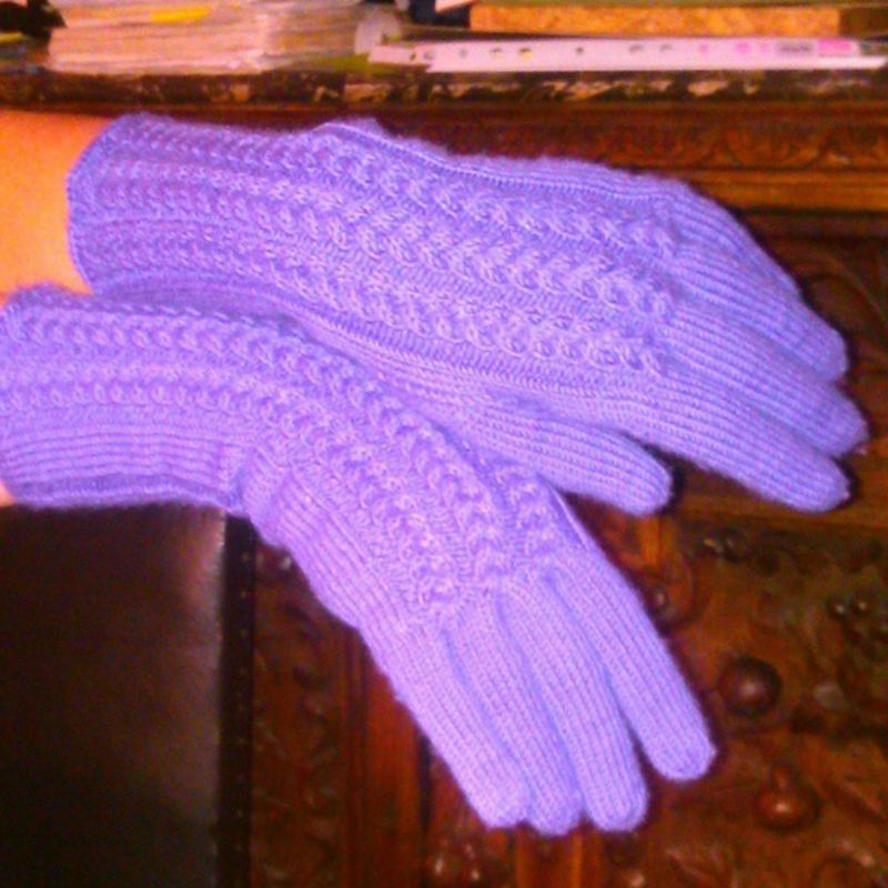 Knitted violet gloves